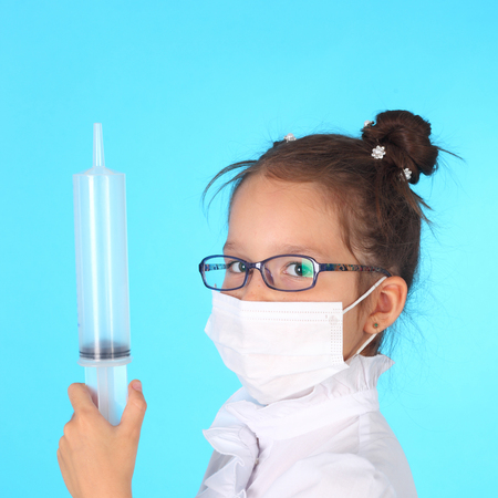 cute little girl playing a doctorの写真素材