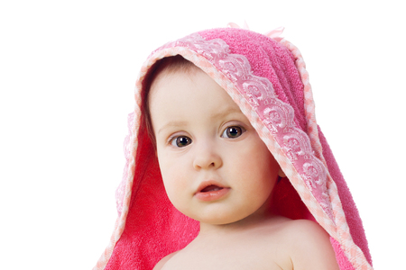 cute sweet little baby under the pink towelの写真素材