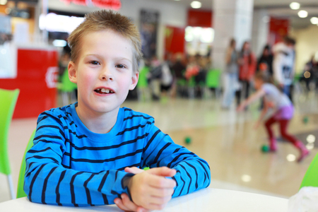 emotional boy in the cafeの写真素材