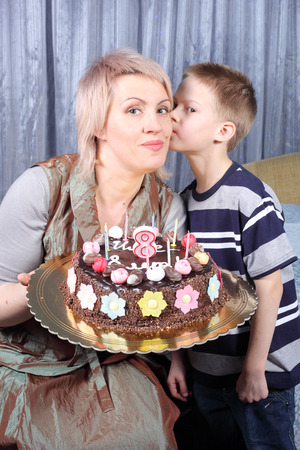 mother and child with the birthday cakeの写真素材