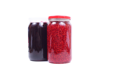 raspberry and currant jam in jar isolatedの写真素材