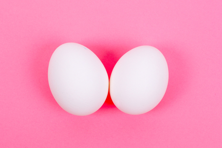 chicken eggs over green backgroundの写真素材