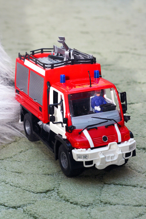 red toy fire-fighting vehicle