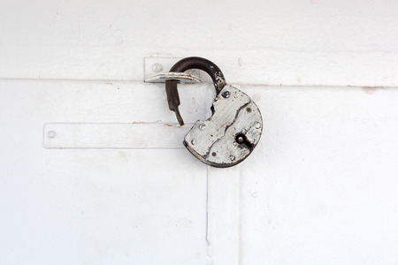 padlock on the white doorの写真素材