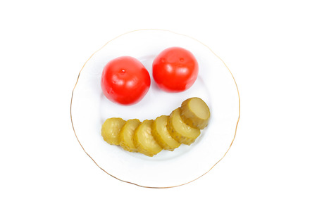 served pickled tomatoes and cucumbers closeupの写真素材