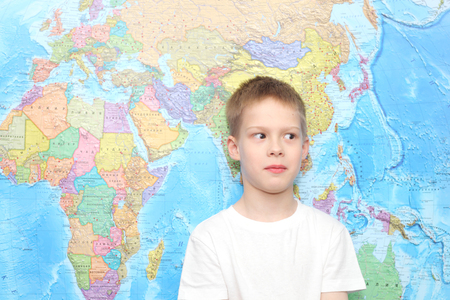 little boy near the wall mapの写真素材