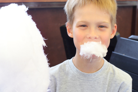 little boy with cotton candyの写真素材