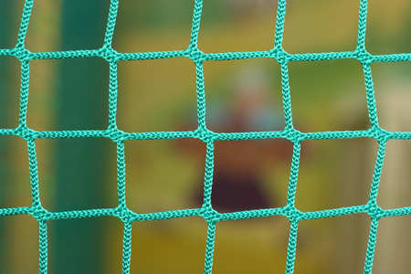 the green braided net used as a fenceの写真素材