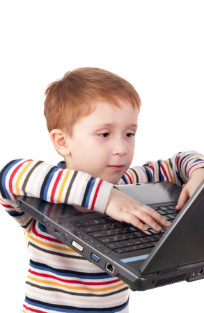cute little boy surfing in internetの写真素材
