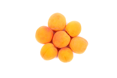 several bright apricots closeup, studioshot の写真素材