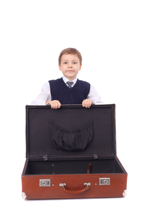 cute little boy with the big suitcaseの写真素材