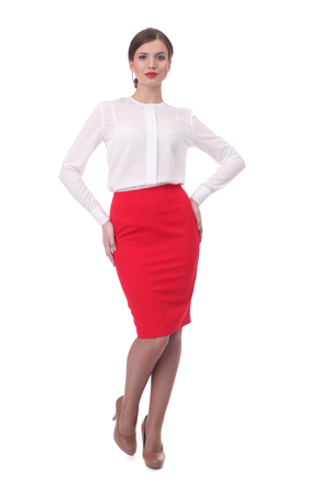 pretty young girl wearing red formal skirt and white blouseの写真素材