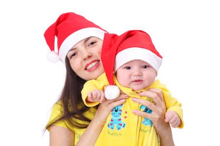 New year family in Santa Claus caps on white backgroundの写真素材