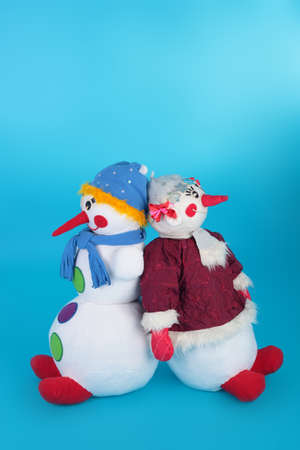 Textile dolls symbols of Christmas on blue backgroundの写真素材
