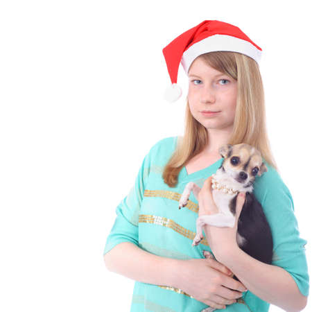 Teen girl with the small dog on white backgroundの写真素材