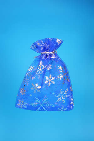 New Year small textile gift bag on blue backgroundの写真素材