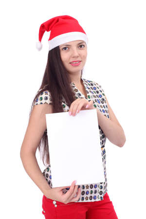 pretty young Christmas girl with the blank sheet of paper, focus on the paperの写真素材