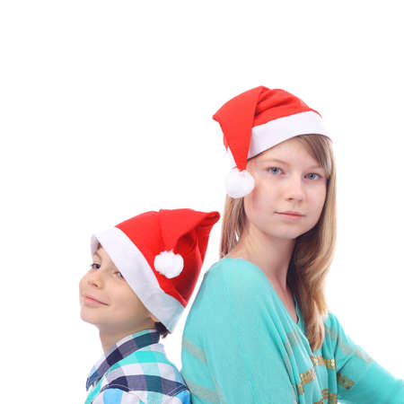 Christmas children in the red capsの写真素材