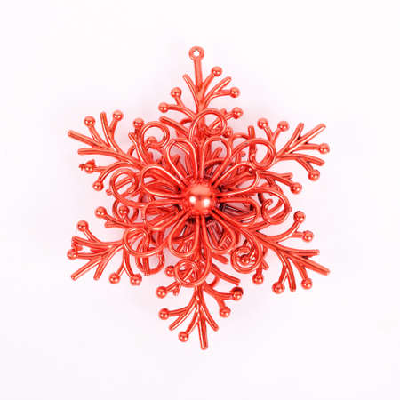 red plastic christmas snowflake souvenirの写真素材