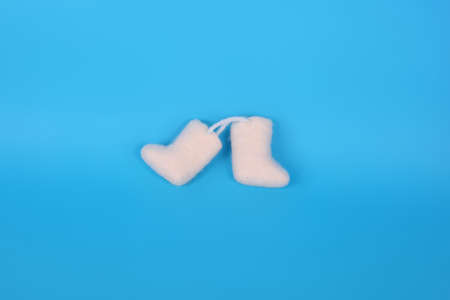 russian souvenir valenki over blue backgroundの写真素材