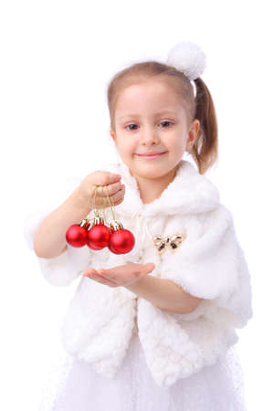 cute little girl with the new year balls, focus on the ballsの写真素材