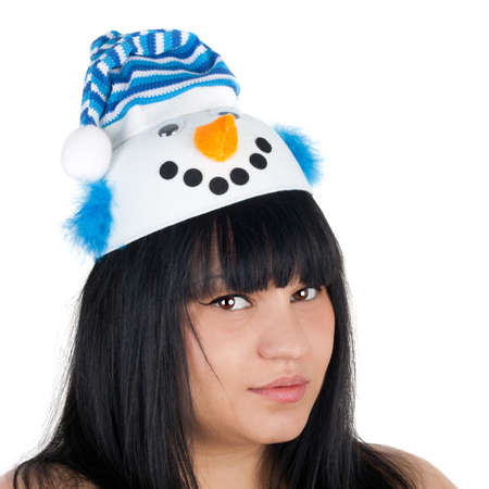 closeup image of the young pretty girl dressed in the snowman capの写真素材