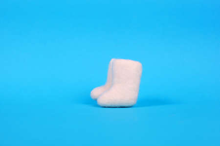 russian souvenir valenki over blue backgroundの写真素材