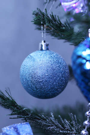 blue bauble hanging on the Christmas treeの写真素材