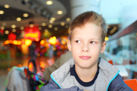 handsome little boy on a christmas fairの写真素材