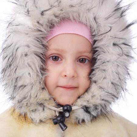 cute little girl in the winter fur coatの写真素材