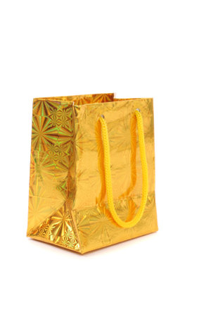 gold gift parcel isolated on whiteの写真素材
