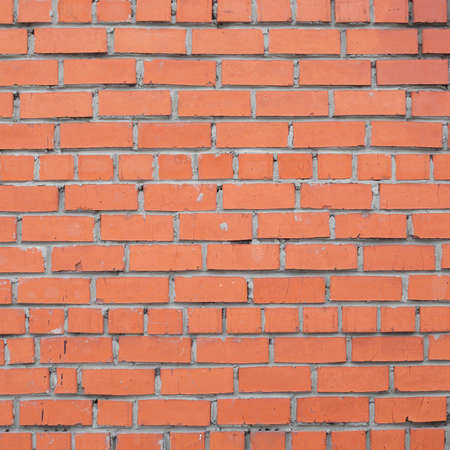 bright red brick wall closeupの写真素材