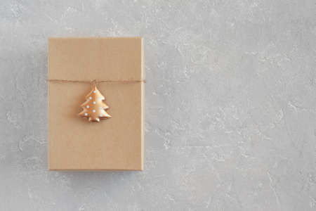 craft paper gift box decorated with metal New Year tree, copy spaceの写真素材