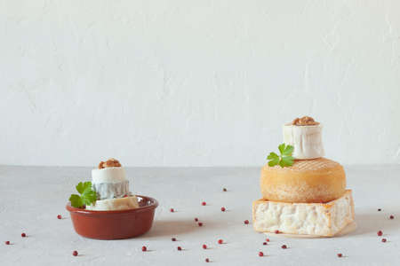 small towers made of different types of cheese, side viewの写真素材