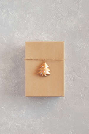 craft paper gift box decorated with golden metal New Year treeの写真素材