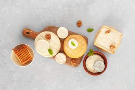 different types of cheese on gray concrete background, top view, bannerの写真素材
