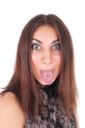 teen girl demonstrating tongue piercingの写真素材