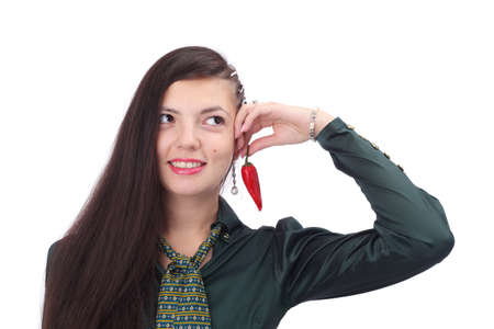 pretty young girl with a chile pepperの写真素材