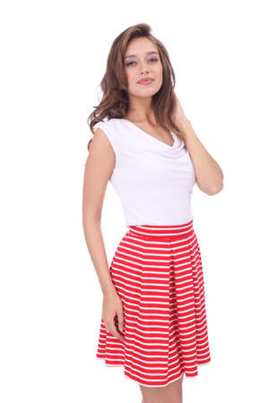 pretty young girl wearing red short striped skirtの写真素材