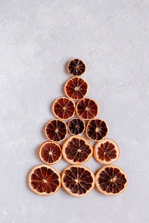 Christmas tree created of dry orange slices, minimalismの写真素材
