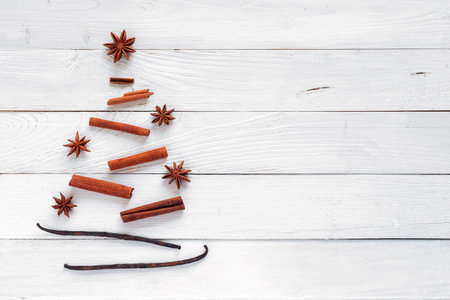 Christmas tree made of spices, white wooden background, top viewの写真素材