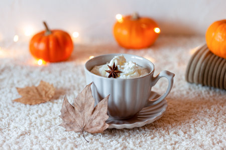 Cosy autumn composition with hot drink and mini pumpkinsの写真素材