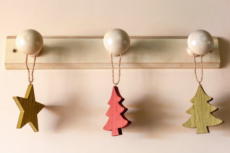 Christmas tree and star form wooden interior suspended decorationの写真素材