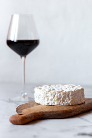 Camembert cheese served with a glass of wineの写真素材