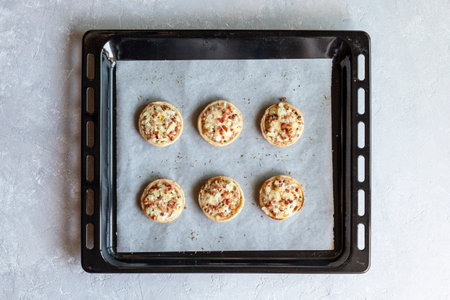 Mini Flammekueche, or tarte flambee, french specialty, on the oven-trayの写真素材