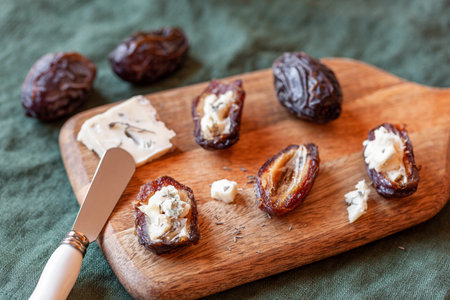 Date fruits stuffed with gorgonzola soft cheeseの写真素材