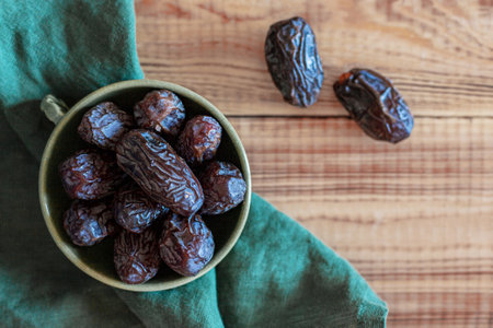 Dates fruits in a bowl, top view, copyspaceの写真素材
