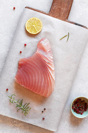 Cooking of raw piece of tuna albacore fishの写真素材