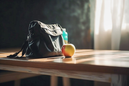 Textile schoolbag with an apple and bottle of water on the wooden table, copyspace, Generative AIの素材
