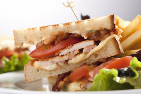 Club sandwich with french fries on the white background, closeup, Generative AIの素材